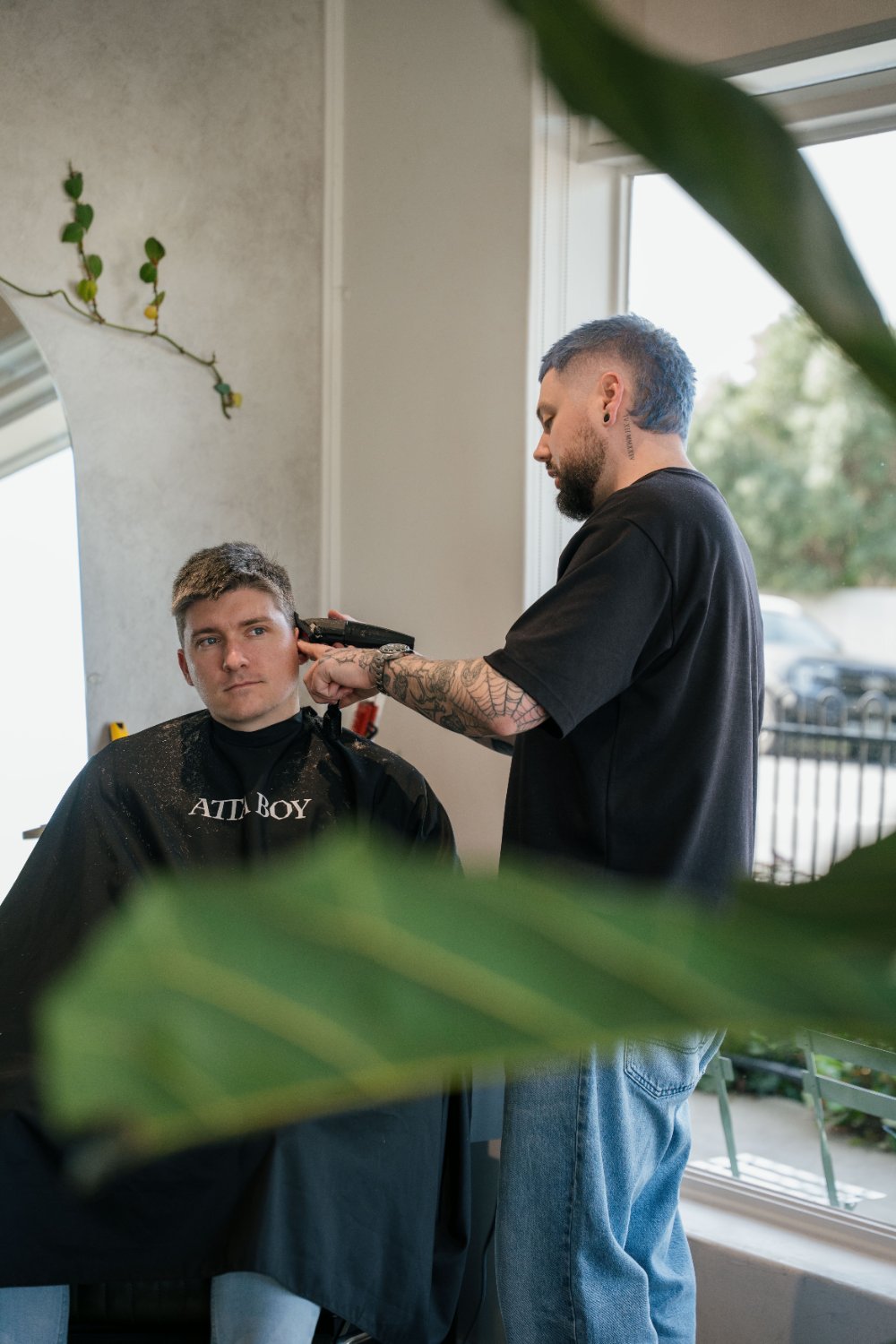 Barber finishing a fresh fade at Attaboy Barbers Henley, Adelaide